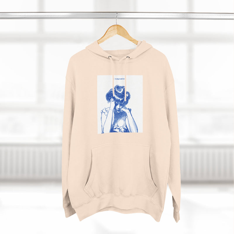 Artistic Female Silhouette Hoodie – Stylish Blue Figure Design on Cozy Beige Sweatshirt