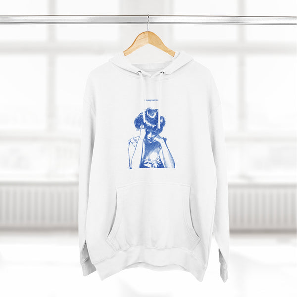 Artistic Female Silhouette Hoodie – Stylish Blue Figure Design on Cozy Beige Sweatshirt