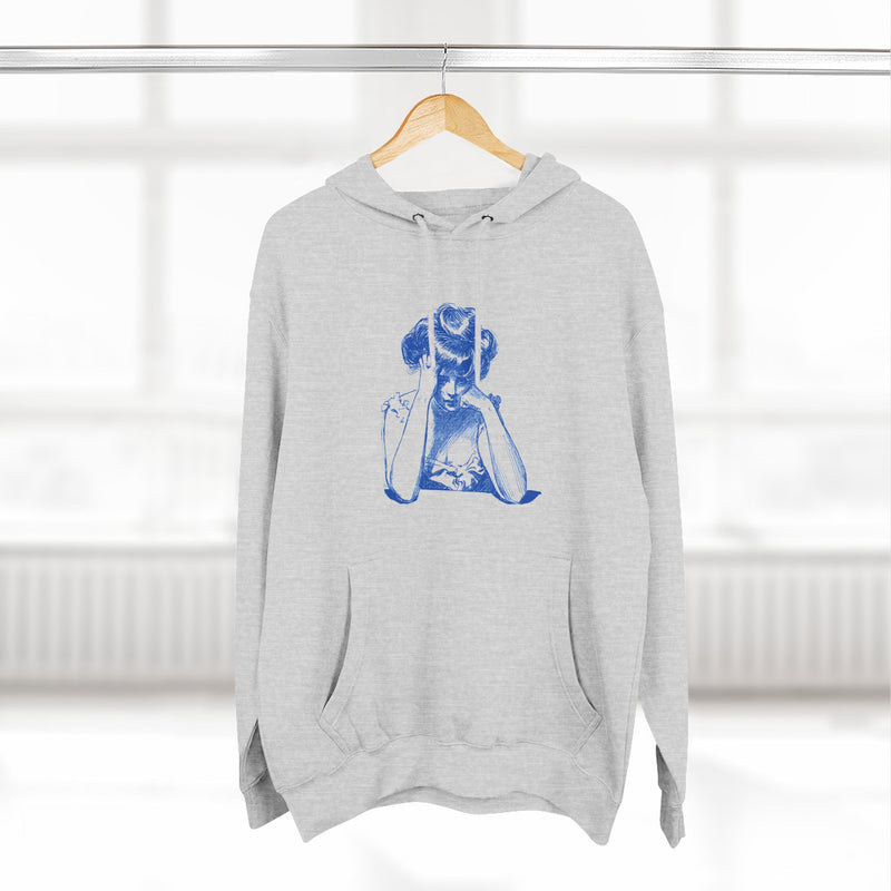 Artistic Female Silhouette Hoodie – Stylish Blue Figure Design on Cozy Beige Sweatshirt