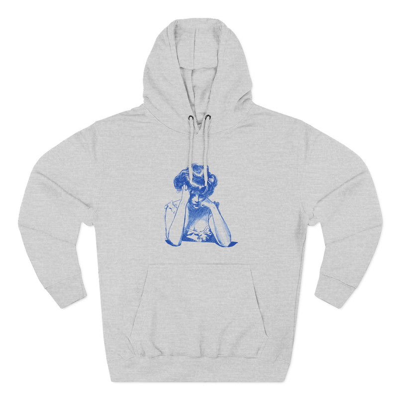 Artistic Female Silhouette Hoodie – Stylish Blue Figure Design on Cozy Beige Sweatshirt