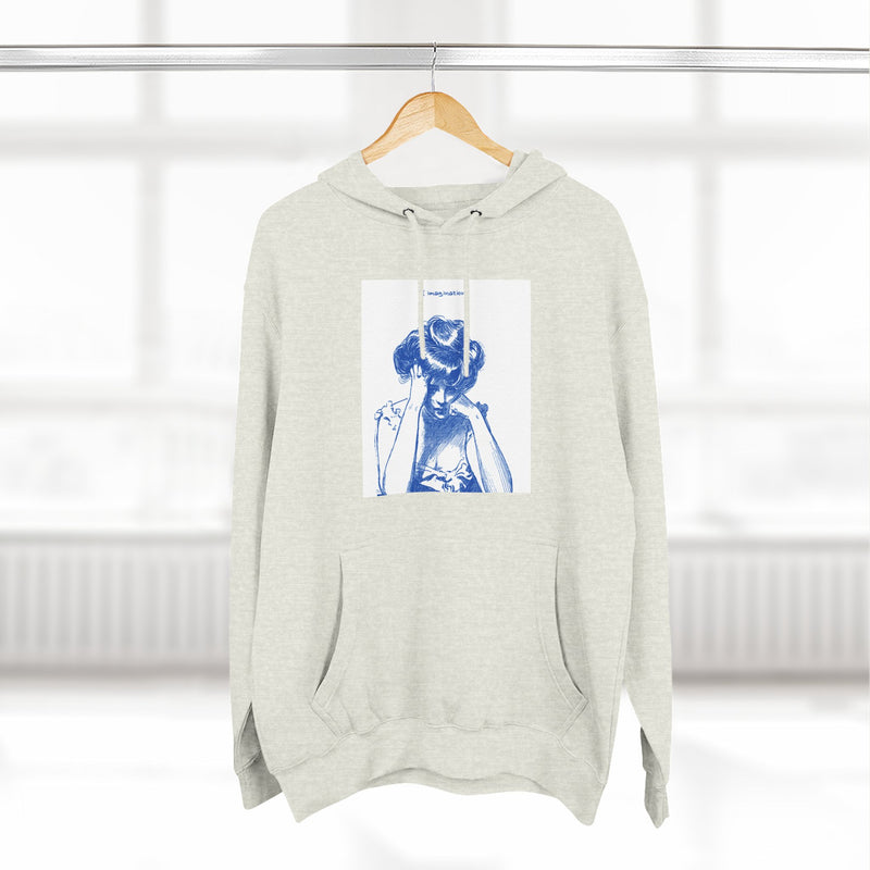 Artistic Female Silhouette Hoodie – Stylish Blue Figure Design on Cozy Beige Sweatshirt